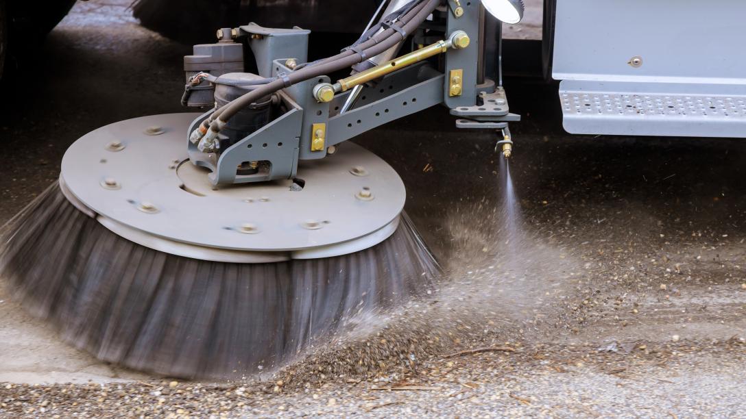 A street sweeping machine cleaning the streets